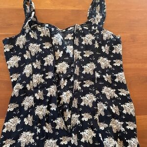 Black maxi dress with beige flower detail